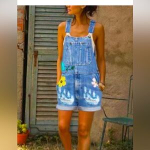 Jean overalls  with pockets and hand painted daisies distressed look.